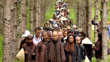 Plum Village Practice Center Thich Nhat Hanh leading walking meditation in Plum Village France 2014