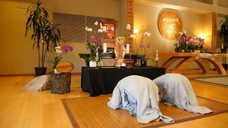 Novices having just ordained are bowing at Thich Nhat Hanh's memorial altar
