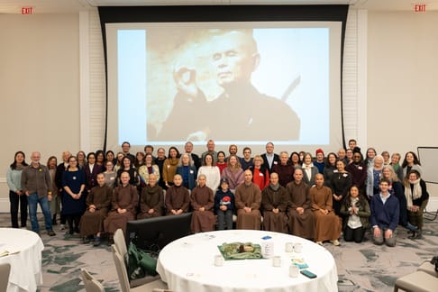 Group photo of Panelists, Speakers, and Attendees of The Buddha the Scientist Symposium