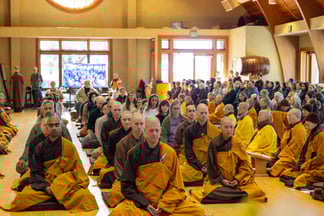 Group of monastics and lay people receiving the 14 Mindfulness Trainings, Ocean of Peace Meditation Hall, Deer Park Monastery, November 2024