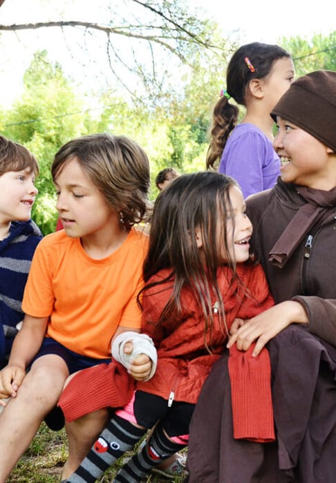 Young nuns practising playful mindfulness with children during the summer retreat 1024x678