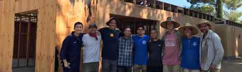 Group of volunteers building the monks residence