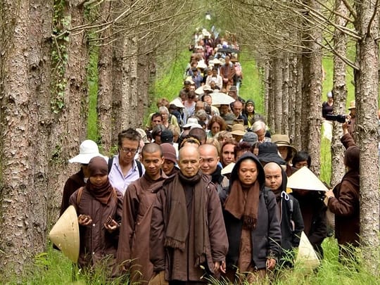 Plum Village Practice Center Thich Nhat Hanh leading walking meditation in Plum Village France